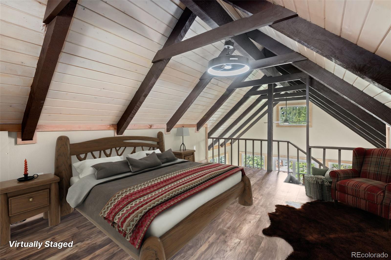 827 Mine Road Idaho Springs, CO 80452 - Photo 18 of 30 a bedroom with bed and a window