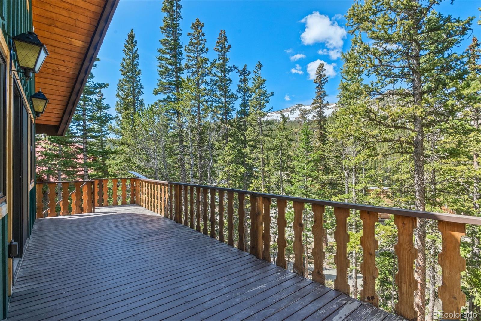 827 Mine Road Idaho Springs, CO 80452 - Photo 20 of 30 a balcony with wooden floor in front of it