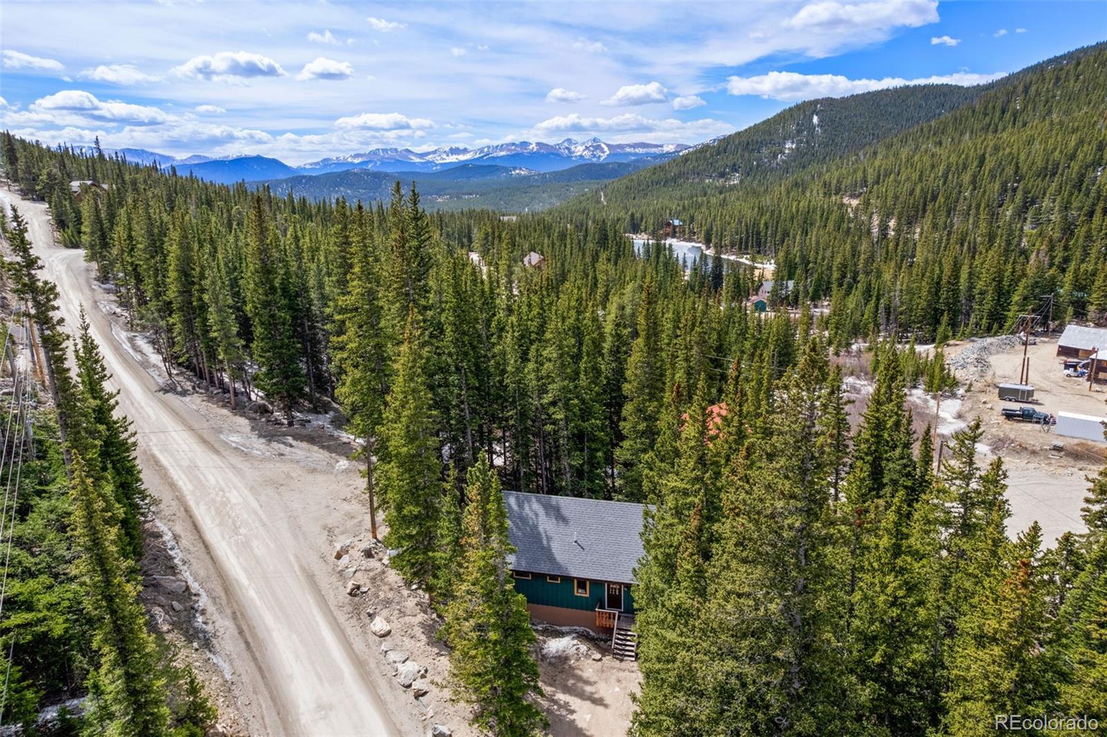 827 Mine Road Idaho Springs, CO 80452 - Photo 26 of 30 a view of a city with lush green forest