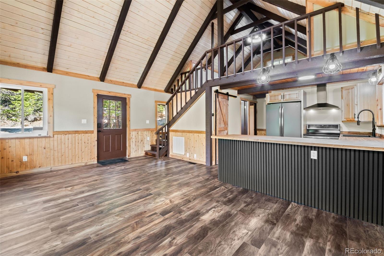 827 Mine Road Idaho Springs, CO 80452 - Photo 8 of 30 a view of staircase with a stove