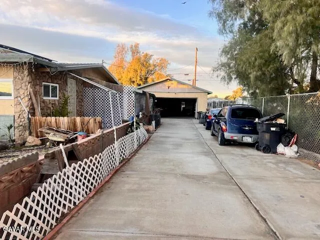 a view of street with parked cars