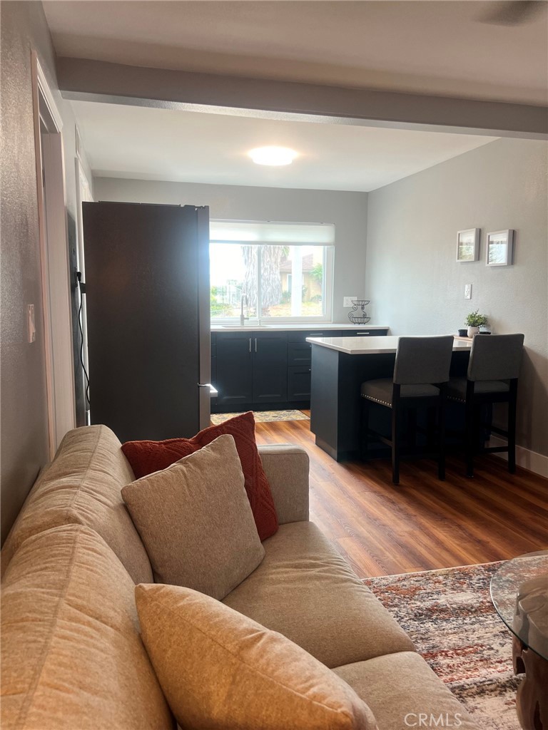 14035 Oakley Drive Riverside, CA 92503 - Photo 11 of 25 a living room with couches and dresser next to a window