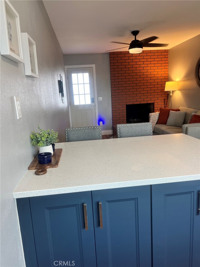 14035 Oakley Drive Riverside, CA 92503 - Photo 12 of 25 a living room with furniture and a fireplace
