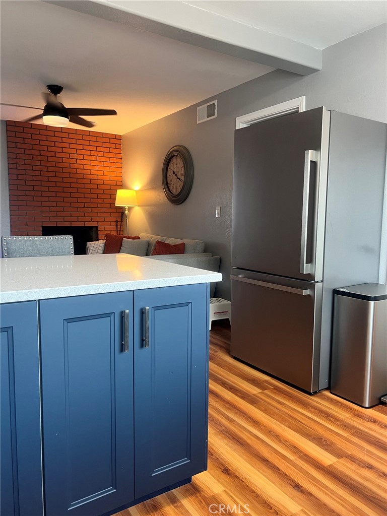 14035 Oakley Drive Riverside, CA 92503 - Photo 14 of 25 a kitchen with a refrigerator and a sink