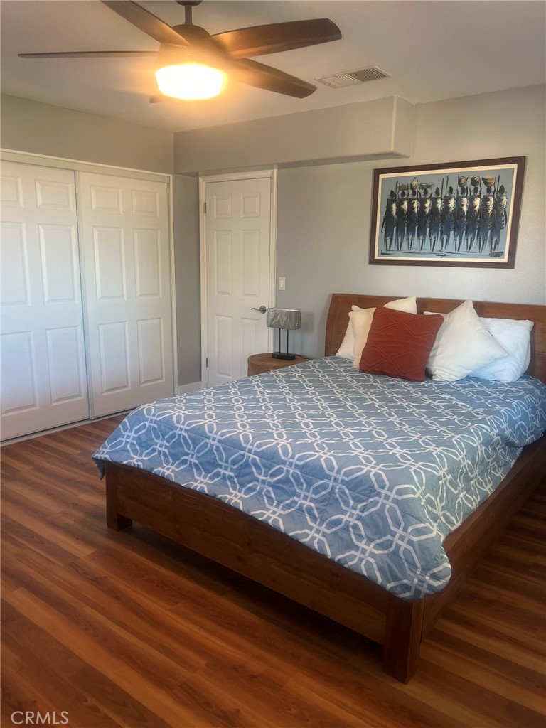 14035 Oakley Drive Riverside, CA 92503 - Photo 17 of 25 a bed sitting in a bedroom next to a cabinet