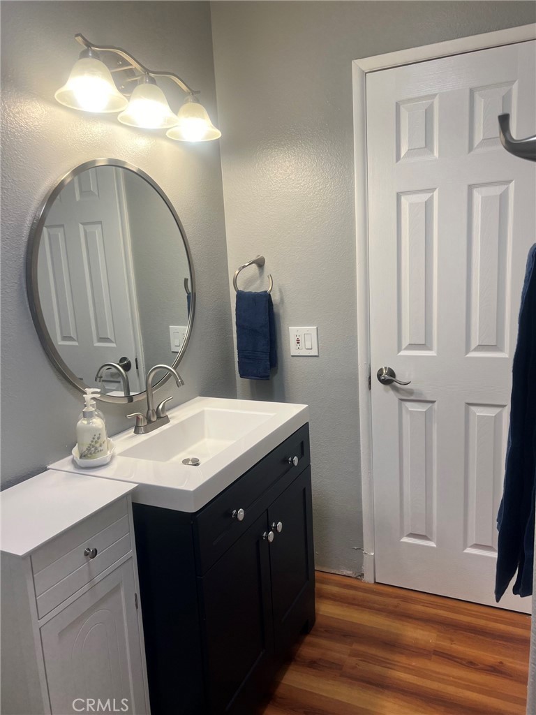 14035 Oakley Drive Riverside, CA 92503 - Photo 18 of 25 a bathroom with a sink vanity and a mirror