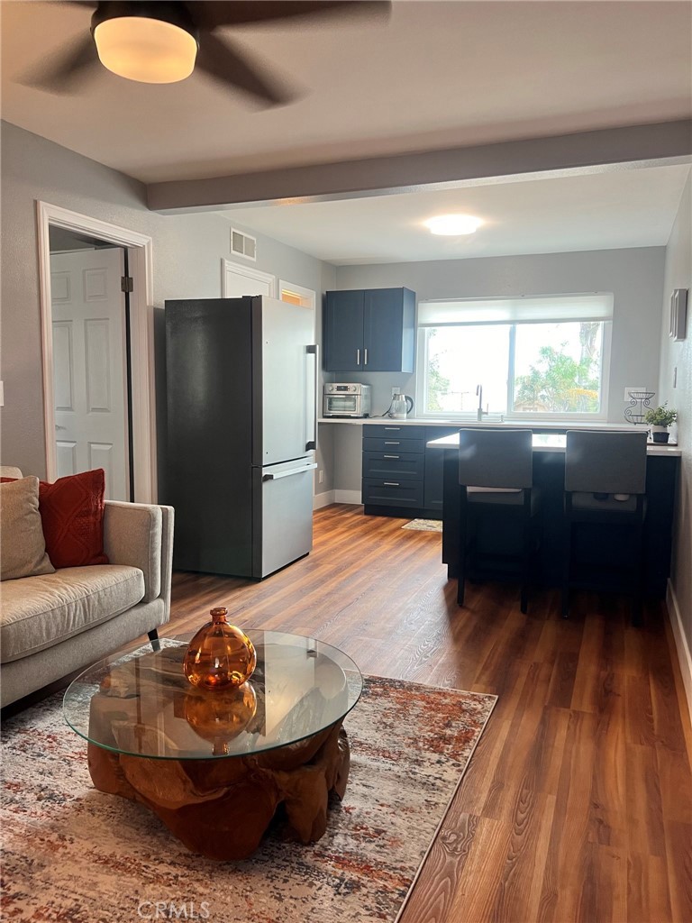 14035 Oakley Drive Riverside, CA 92503 - Photo 7 of 25 a living room with furniture and a wooden floor
