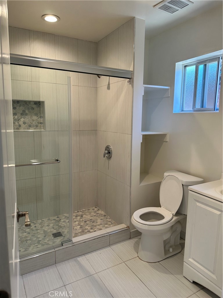 1636 West 214th Street Torrance, CA 90501 - Photo 11 of 14 a bathroom with a toilet and a shower