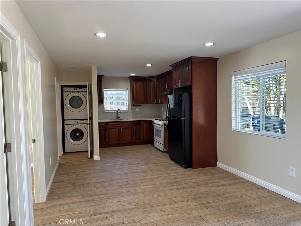 1636 West 214th Street Torrance, CA 90501 - Photo 3 of 14 a view of a kitchen with a refrigerator cabinet mirror and windows