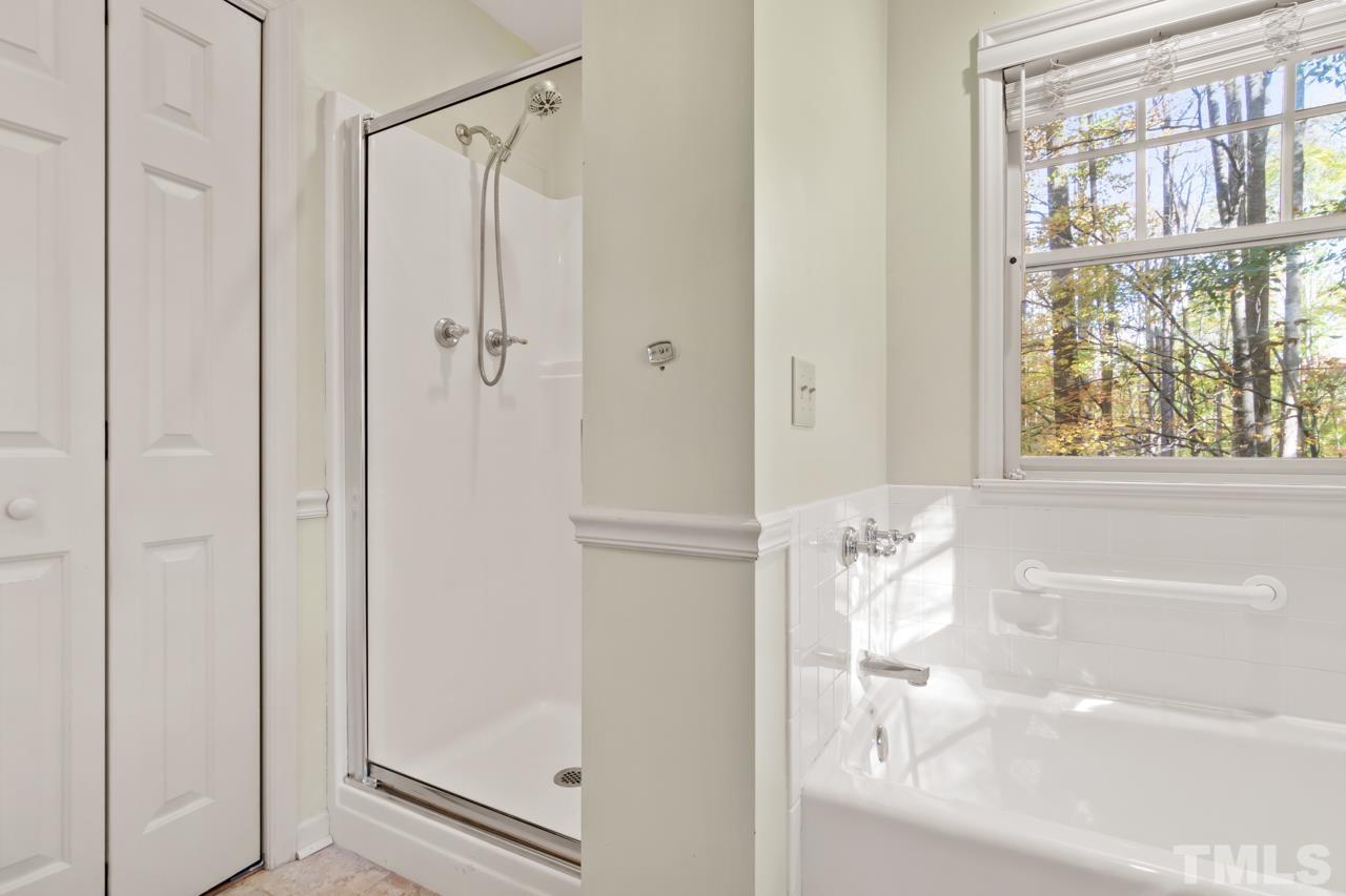1208 John Jones Road Bahama, NC 27503 - Photo 14 of 30 a bathroom with a bathtub and a shower
