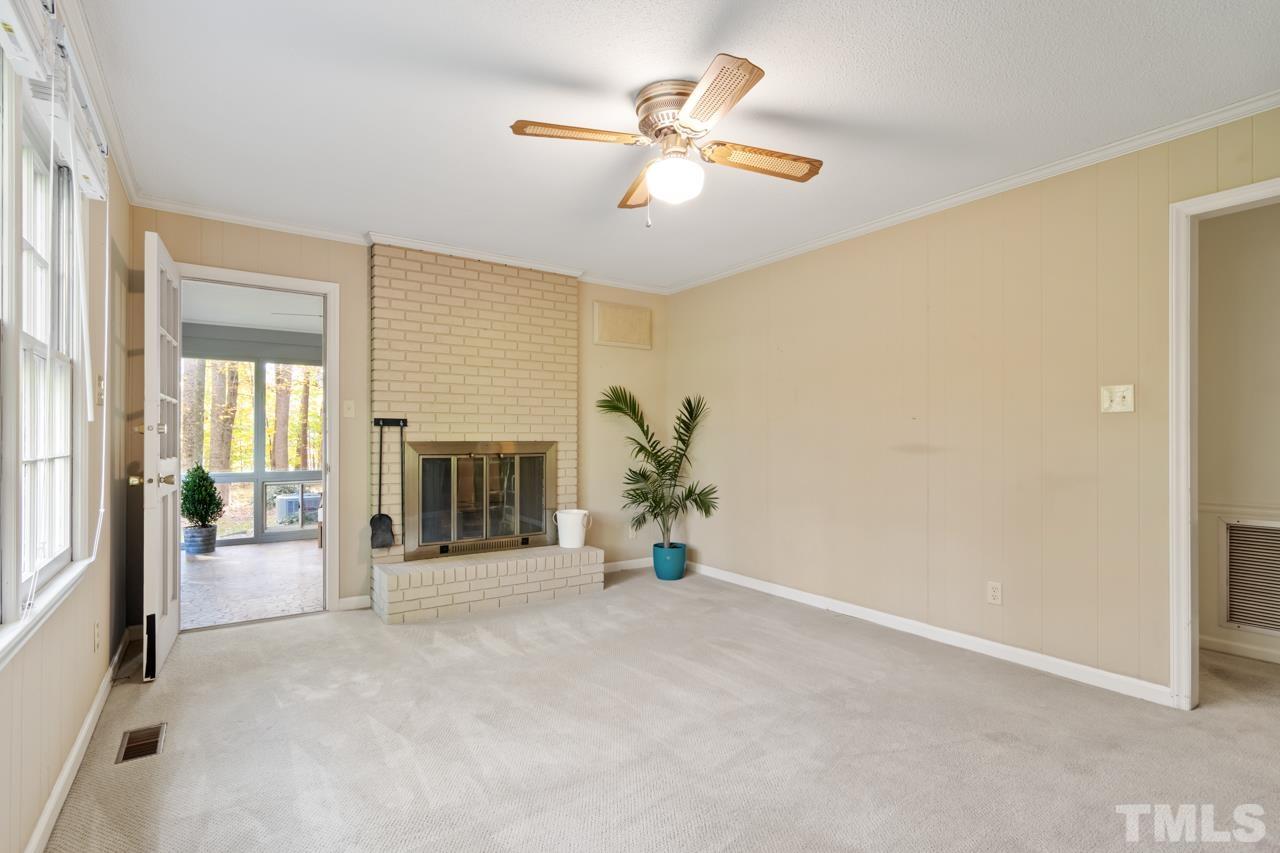 1208 John Jones Road Bahama, NC 27503 - Photo 8 of 30 a view of a livingroom with a ceiling fan and window