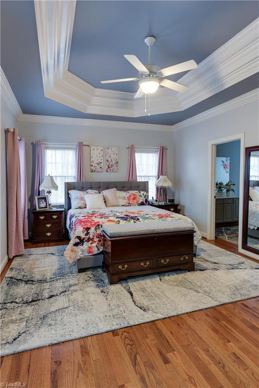 7925 Old Salisbury Road Linwood, NC 27299 - Photo 15 of 31 Tray ceiling with ceiling fan and hardwood floors