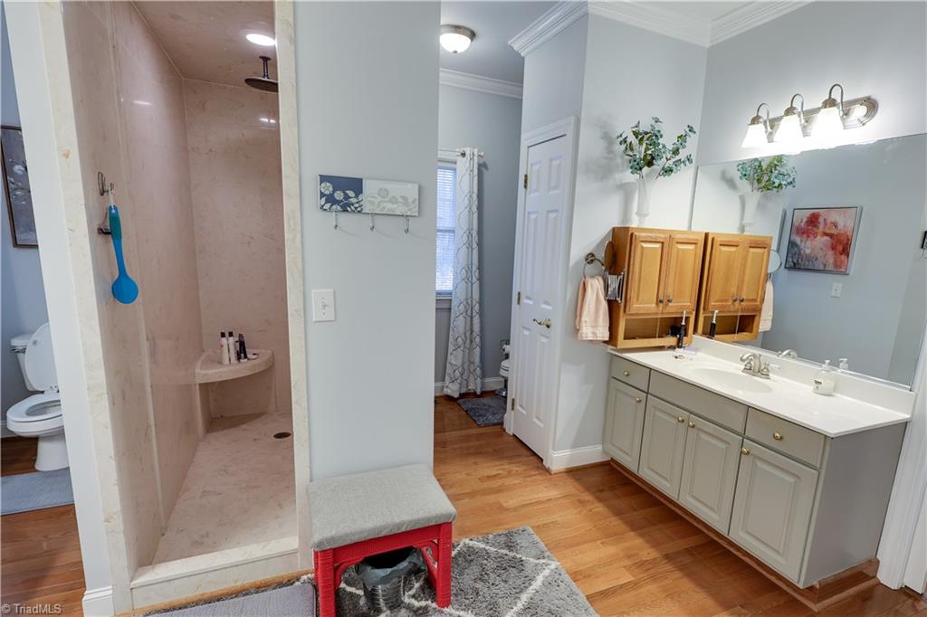 7925 Old Salisbury Road Linwood, NC 27299 - Photo 18 of 31 Master bathroom has two toilets, single sink on this side