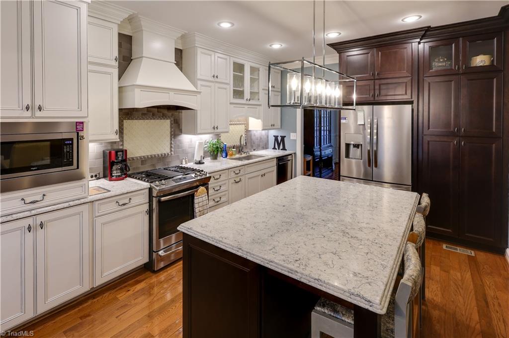 7925 Old Salisbury Road Linwood, NC 27299 - Photo 5 of 31 Granite countertop kitchen, side by side refrigerator, built in microwave, pantry