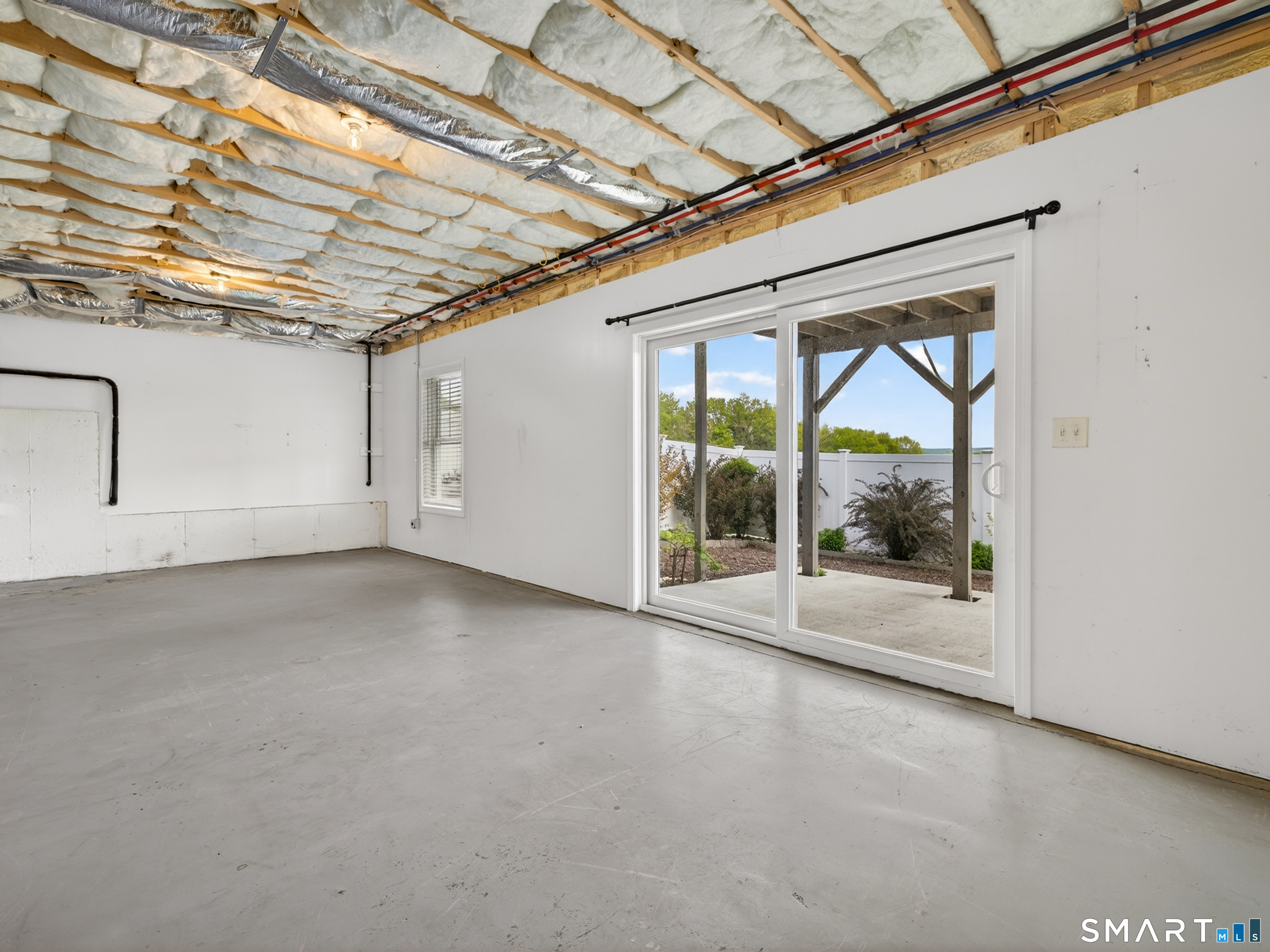 650 Ridgewood Road Middletown, CT 06457 - Photo 31 of 40 a view of an empty room with a sliding door