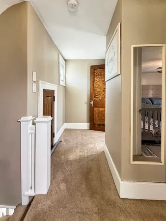 a view of a kitchen with a sink and a fireplace