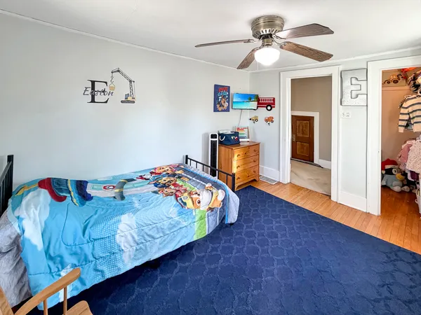 a bedroom with furniture and a chandelier