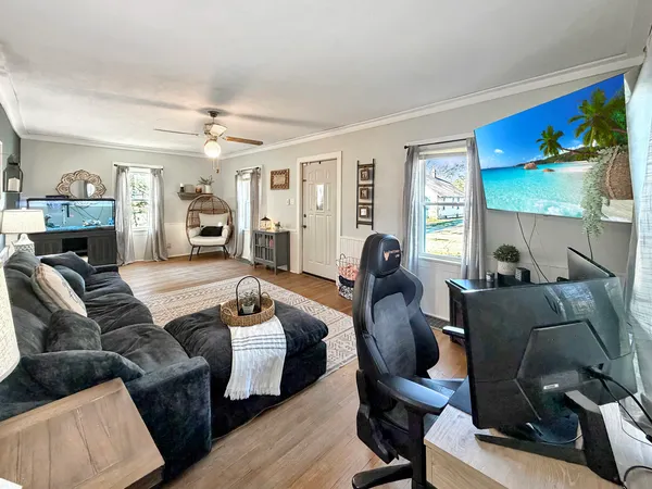 a living room with furniture and a fireplace