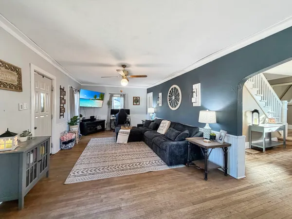 a living room with furniture and a table