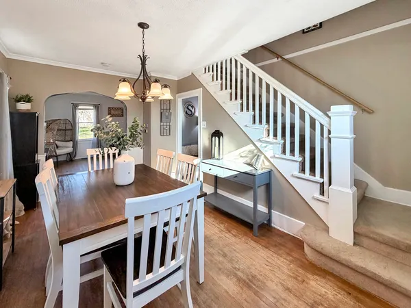 a view of a livingroom with furniture stairs