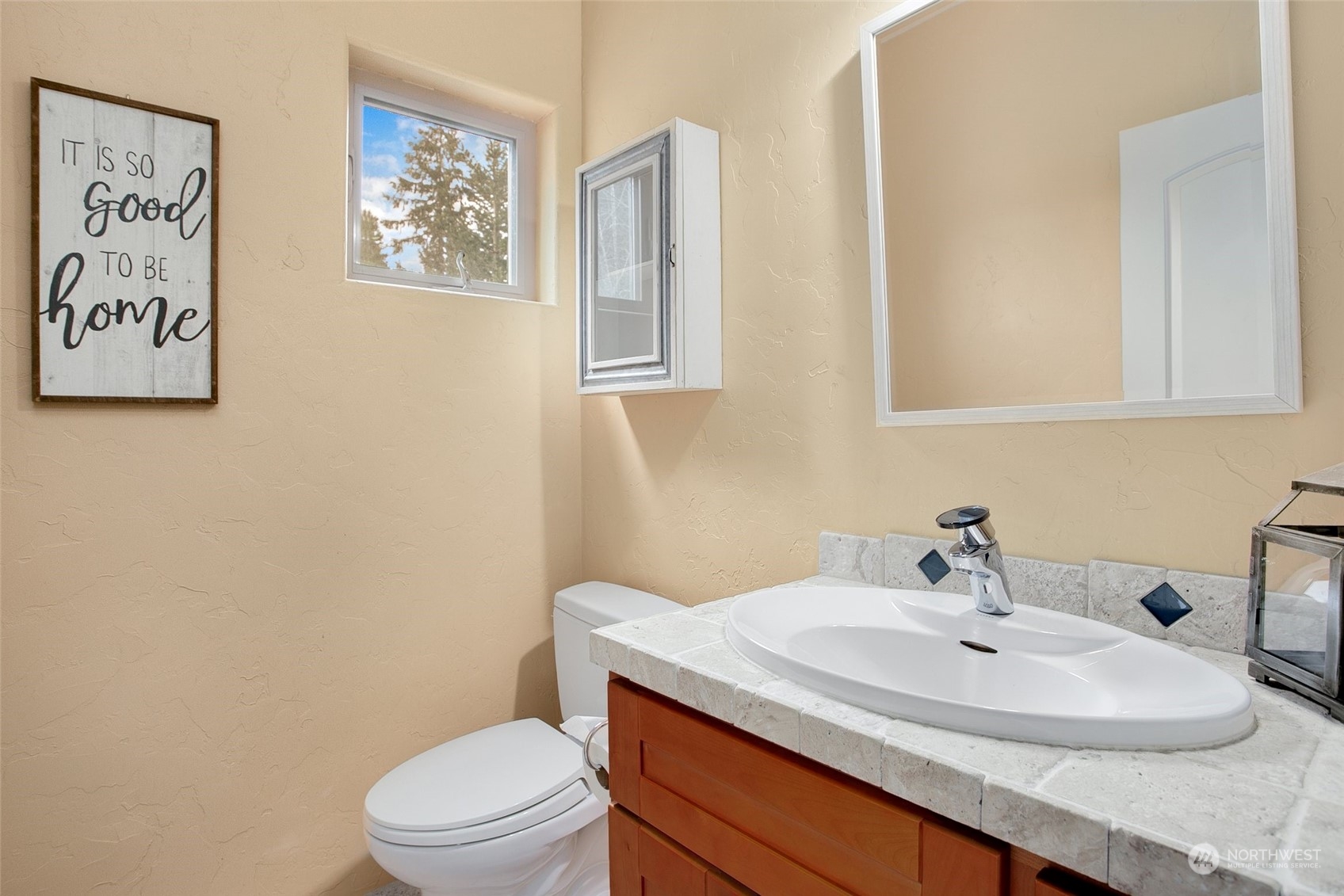 943 Summit Lake Shore Road Northwest Olympia, WA 98502 - Photo 11 of 40 a bathroom with a sink and a toilet