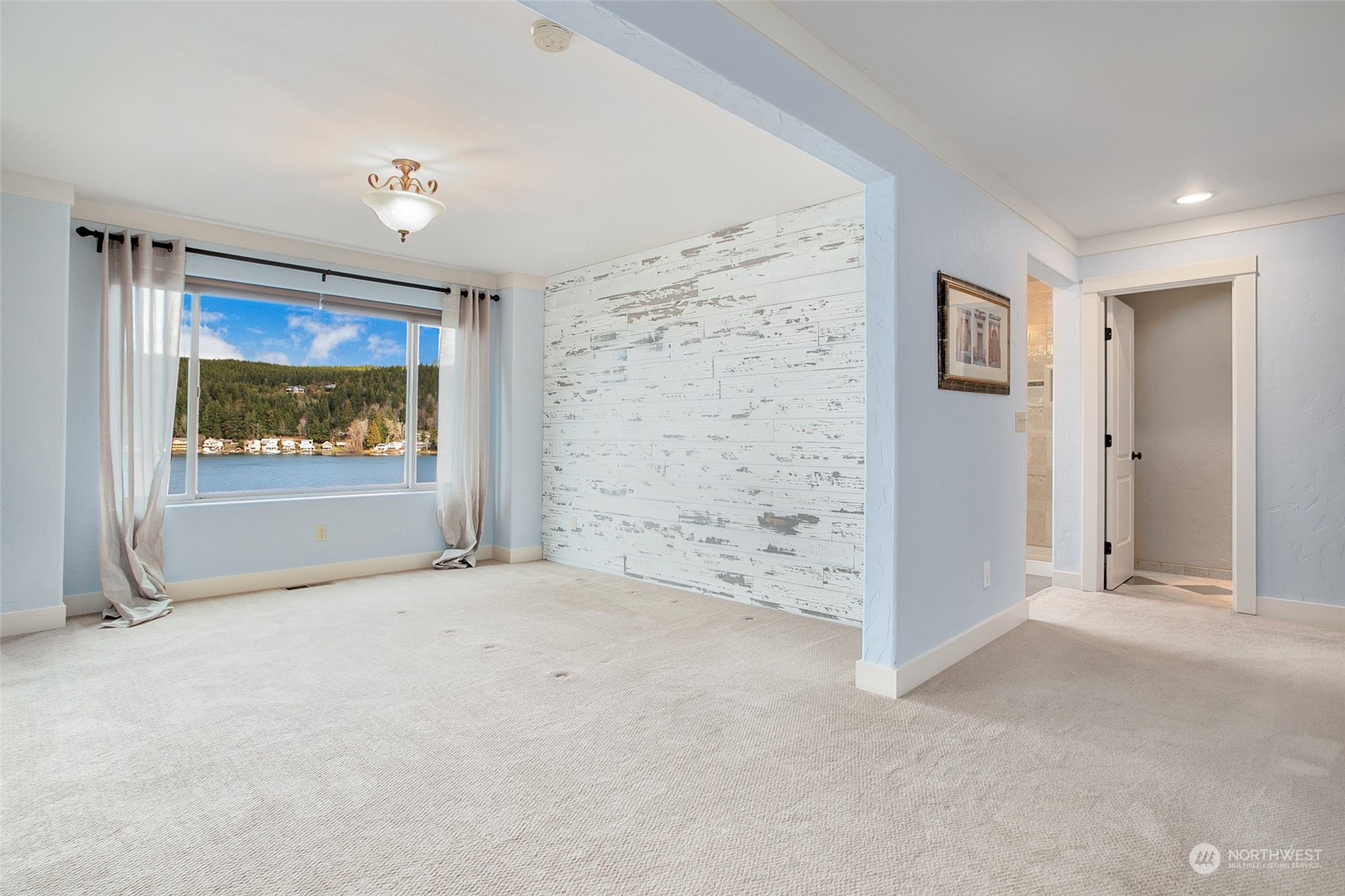 943 Summit Lake Shore Road Northwest Olympia, WA 98502 - Photo 15 of 40 an empty room with windows and closet