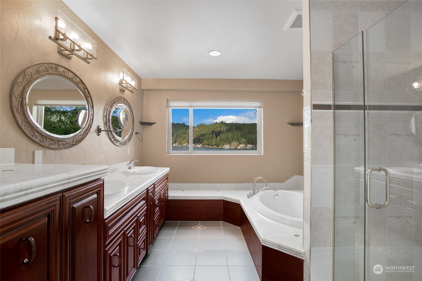 943 Summit Lake Shore Road Northwest Olympia, WA 98502 - Photo 16 of 40 a bathroom with a sink a bathtub and a mirror