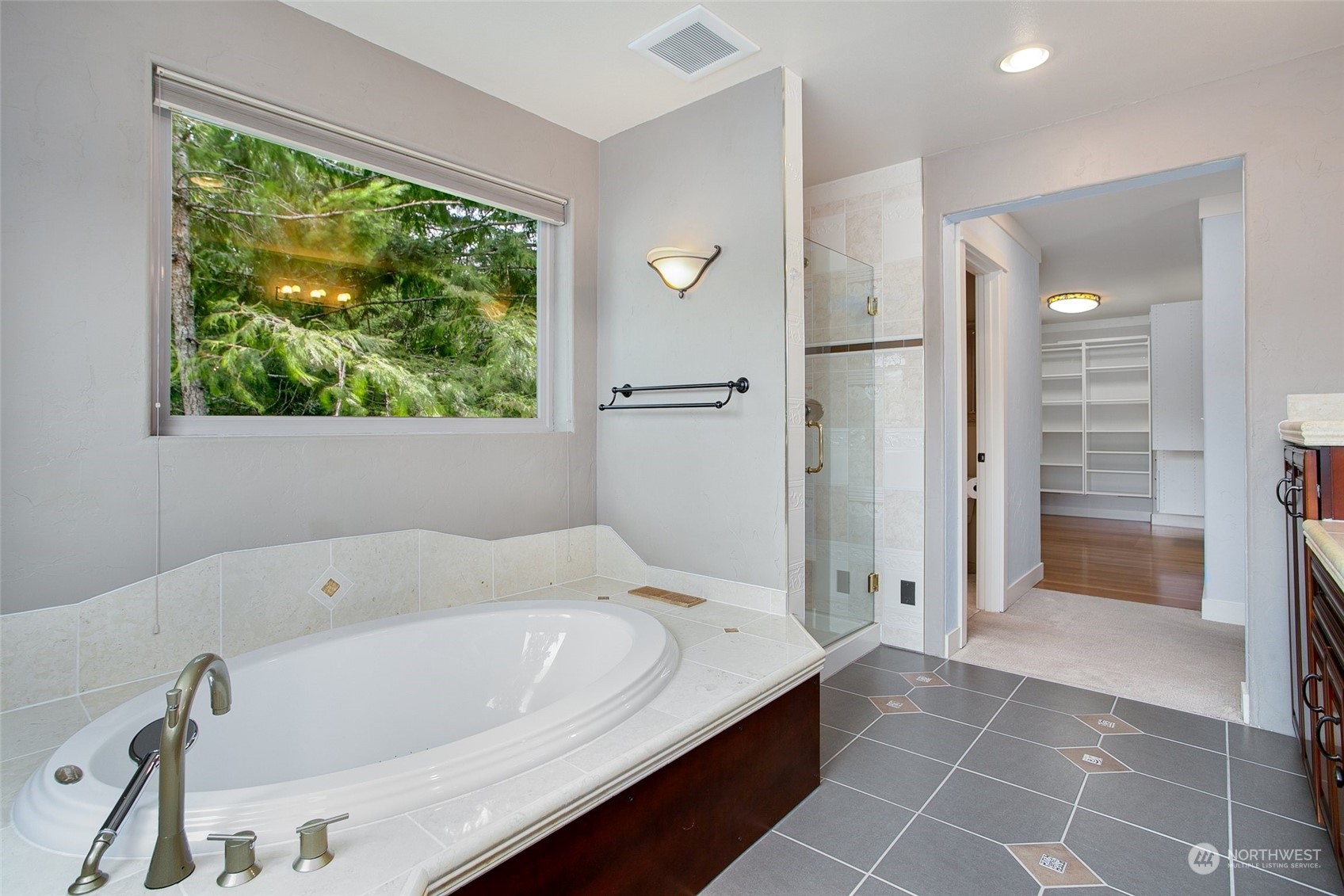943 Summit Lake Shore Road Northwest Olympia, WA 98502 - Photo 17 of 40 a bathroom with a bathtub and a shower