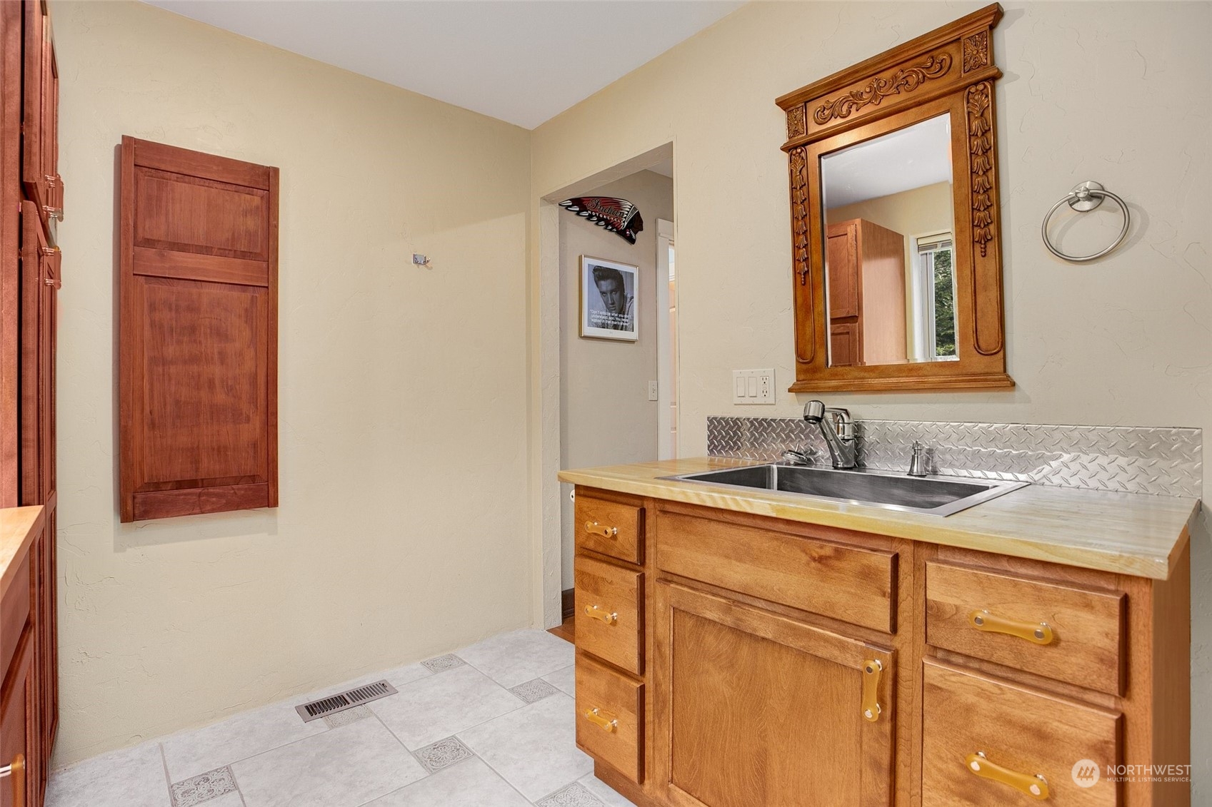 943 Summit Lake Shore Road Northwest Olympia, WA 98502 - Photo 20 of 40 a bathroom with a sink and a mirror