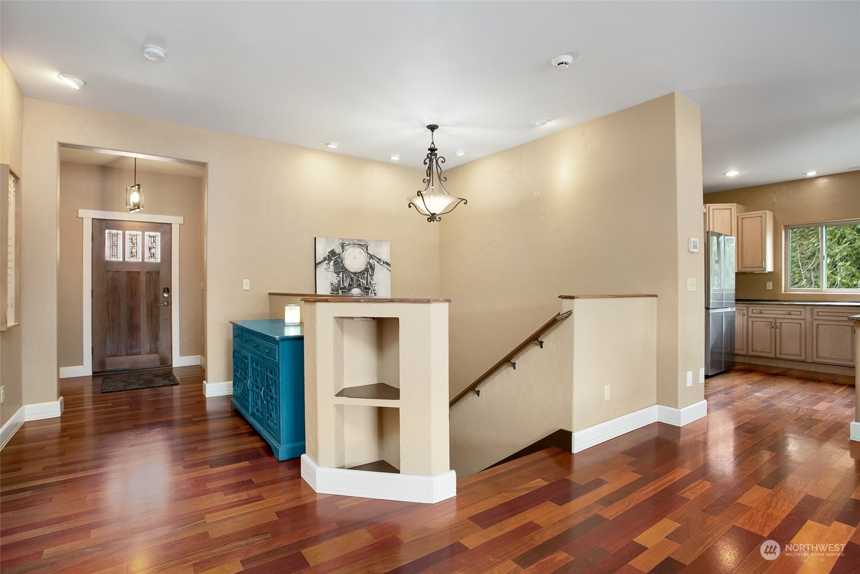 943 Summit Lake Shore Road Northwest Olympia, WA 98502 - Photo 2 of 40 a view of a hallway with wooden floor and staircase