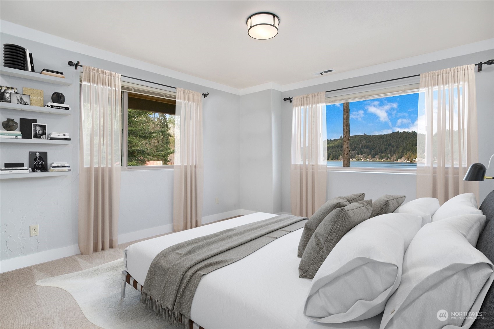 943 Summit Lake Shore Road Northwest Olympia, WA 98502 - Photo 23 of 40 a bedroom with a bed and a window