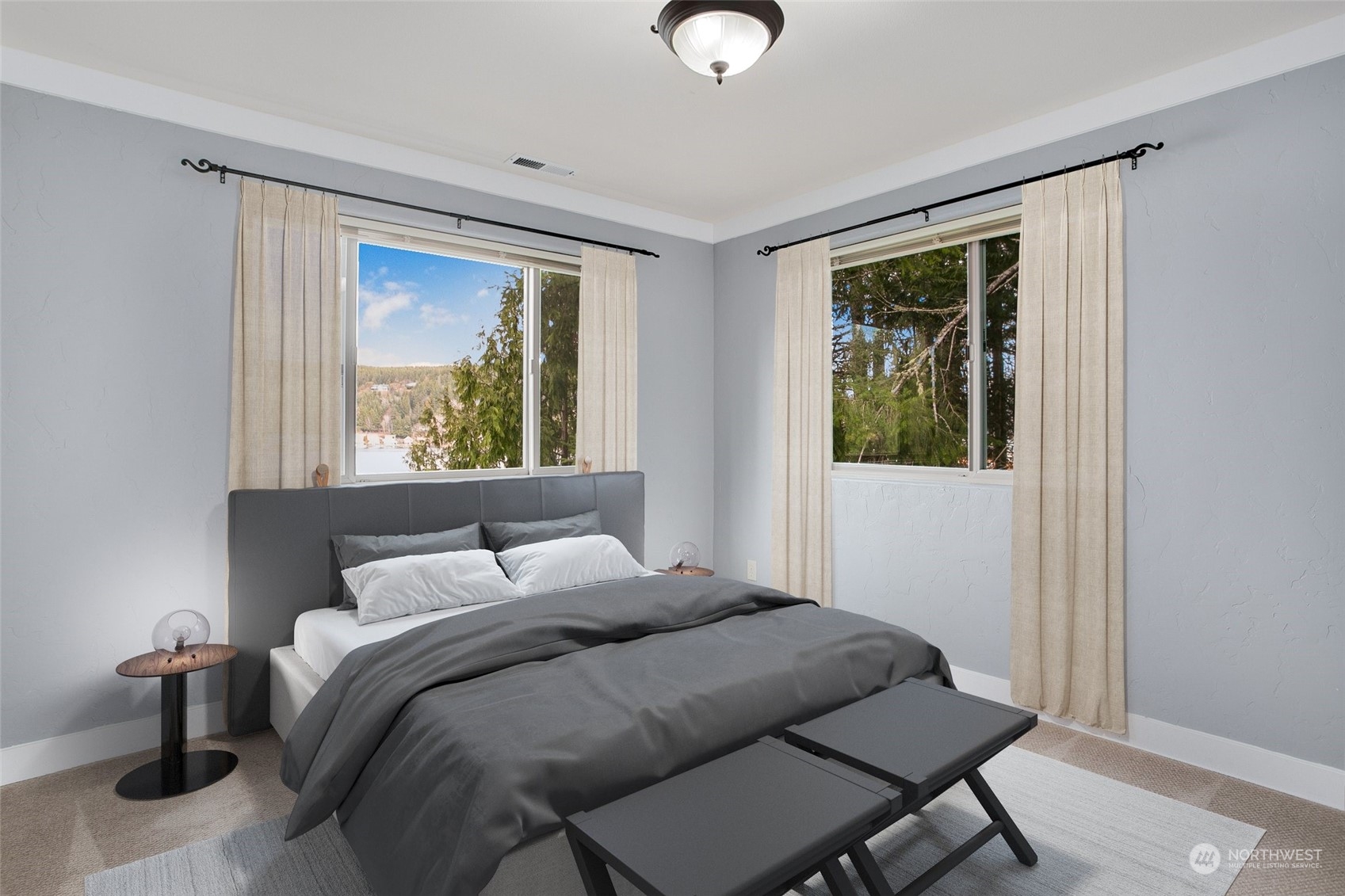 943 Summit Lake Shore Road Northwest Olympia, WA 98502 - Photo 24 of 40 a bedroom with a bed and window