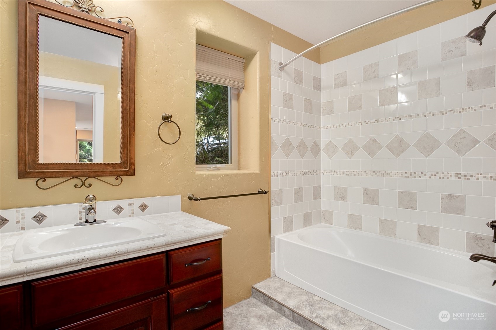 943 Summit Lake Shore Road Northwest Olympia, WA 98502 - Photo 25 of 40 a bathroom with a tub sink and mirror