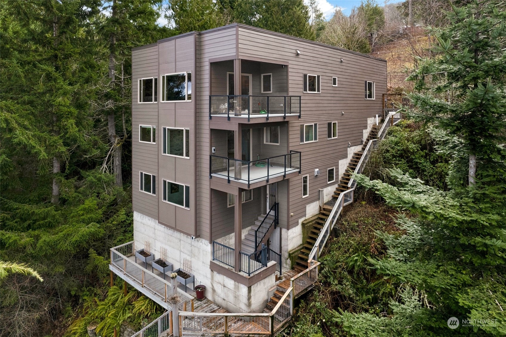 943 Summit Lake Shore Road Northwest Olympia, WA 98502 - Photo 27 of 40 a front view of a house with balcony