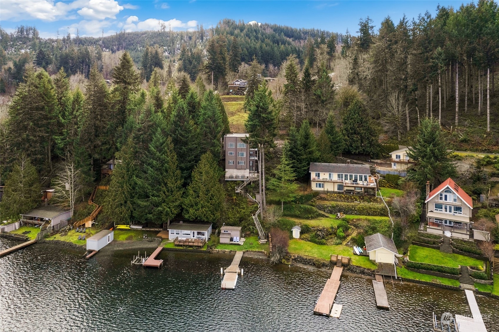 943 Summit Lake Shore Road Northwest Olympia, WA 98502 - Photo 32 of 40 a view of a swimming pool with a bench and some trees