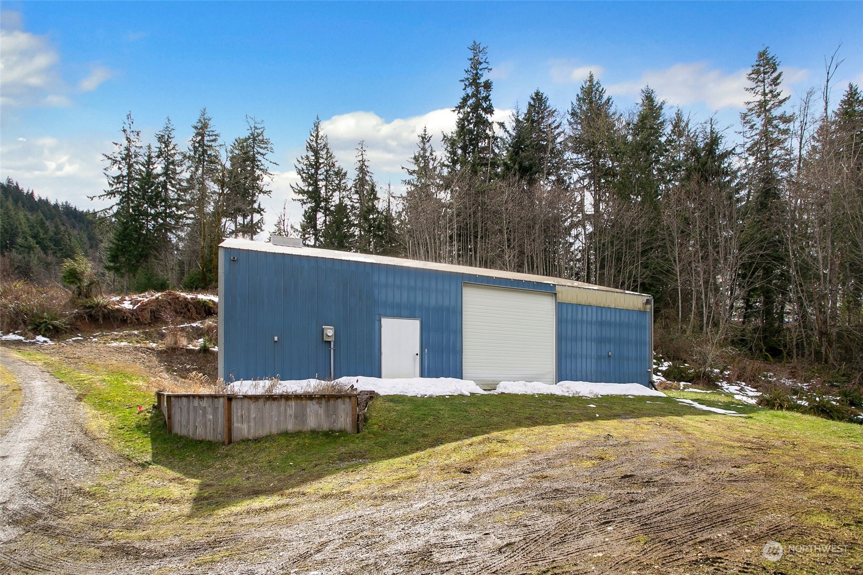 943 Summit Lake Shore Road Northwest Olympia, WA 98502 - Photo 35 of 40 a view of a house with a yard and large tree