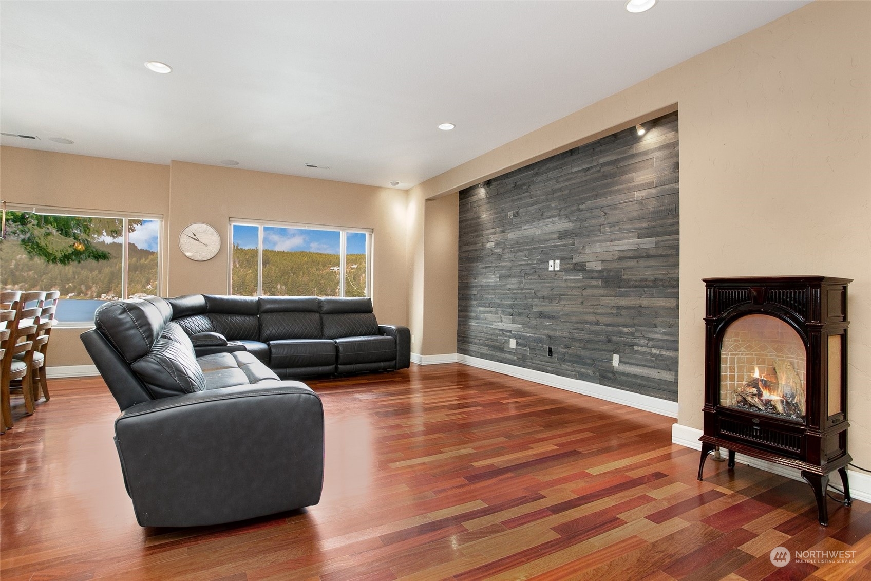 943 Summit Lake Shore Road Northwest Olympia, WA 98502 - Photo 4 of 40 a living room with furniture and a fireplace