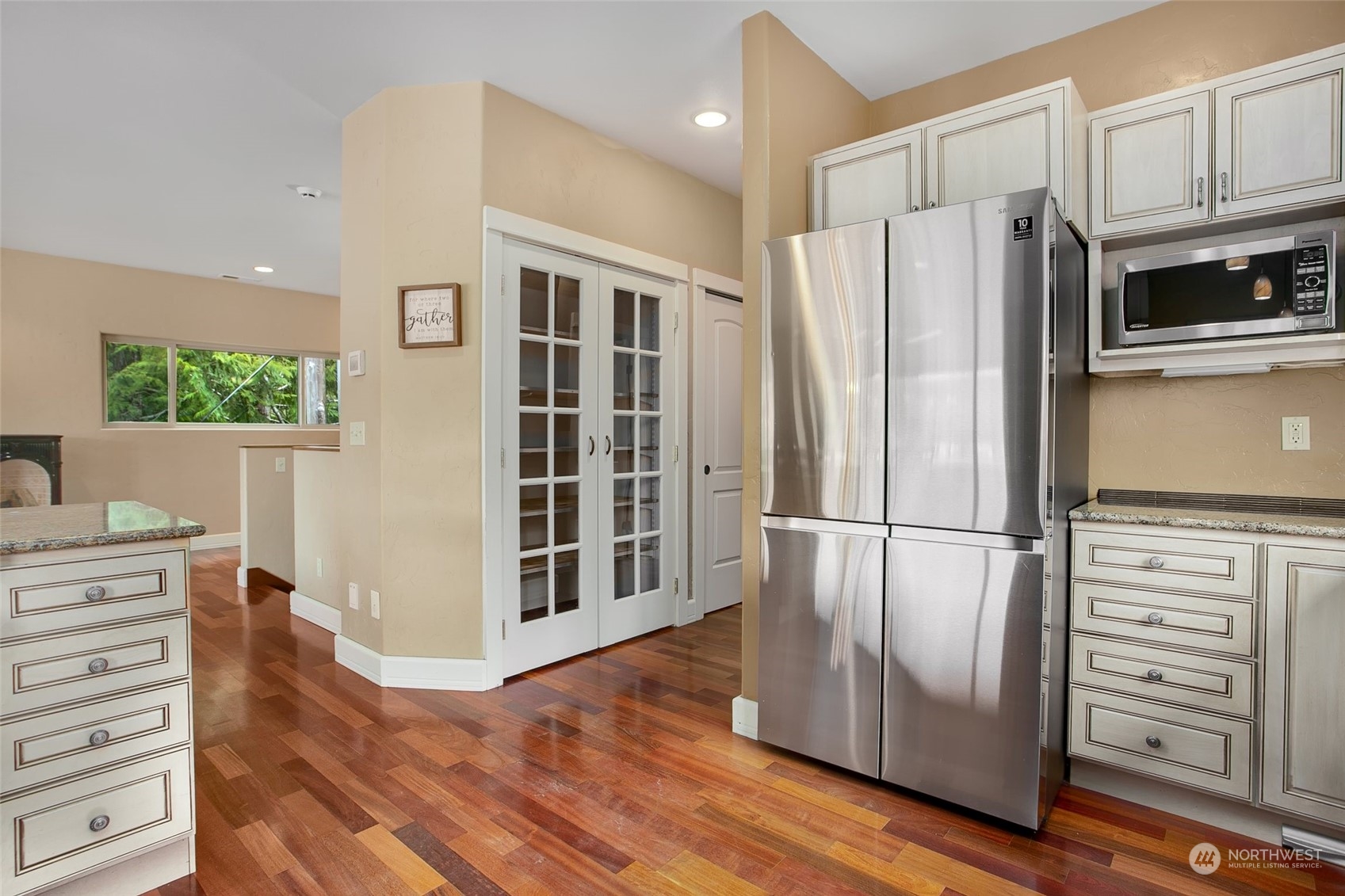 943 Summit Lake Shore Road Northwest Olympia, WA 98502 - Photo 10 of 40 a view of kitchen with stainless steel appliances wooden floor and window