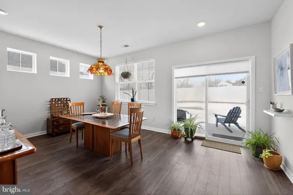 a view of a workspace with furniture window and wooden floor