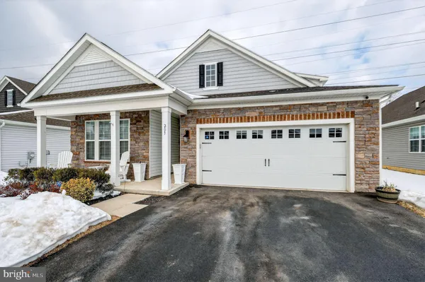 a front view of a house with a garage