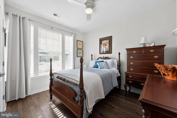a bed room with a bed and a window