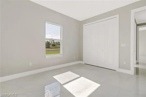 a view of an empty room with windows