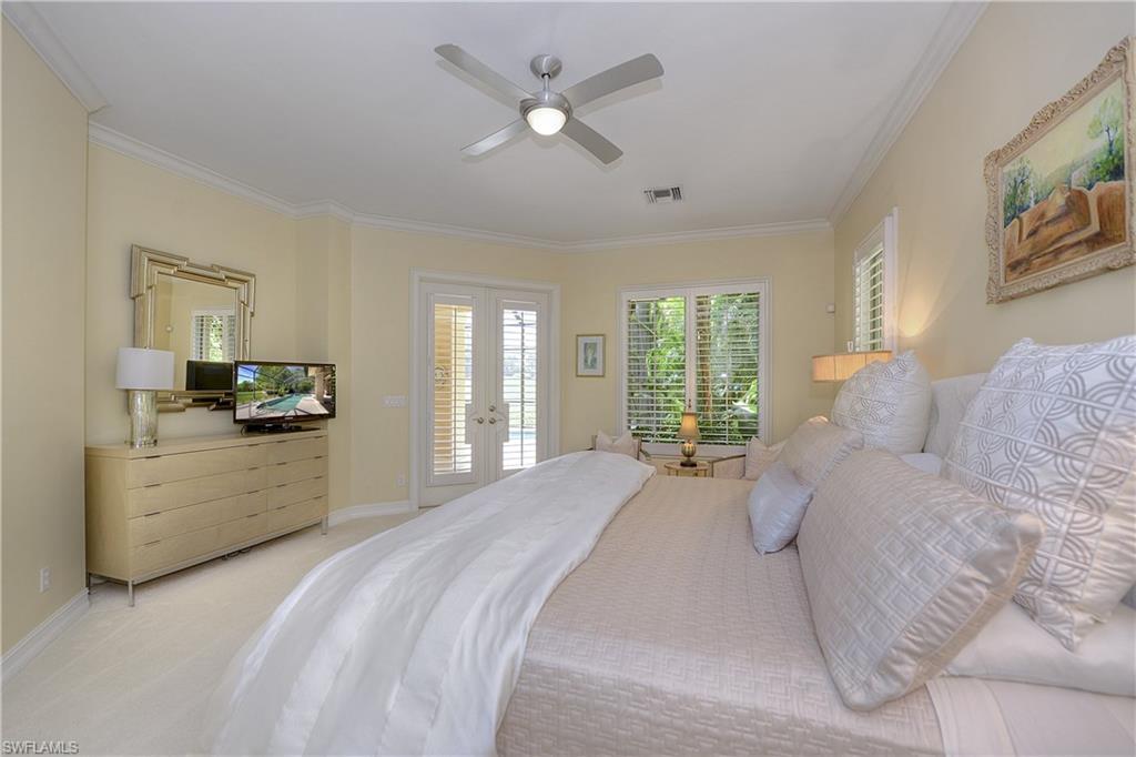 3274 Sedge Place Naples, FL 34105 - Photo 12 of 24 a large white bed in a white room