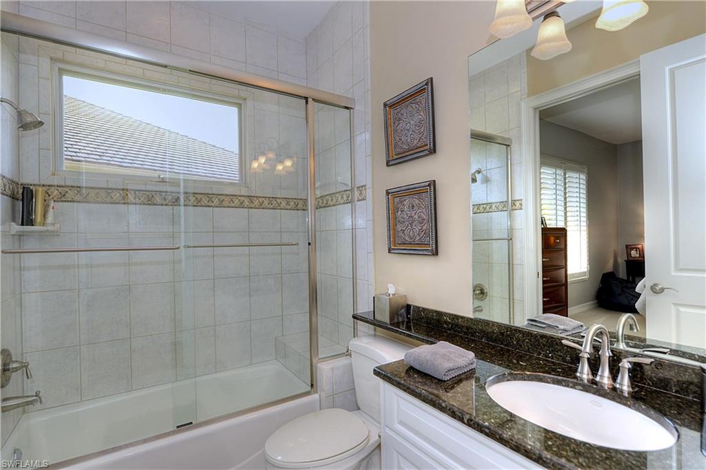 3274 Sedge Place Naples, FL 34105 - Photo 18 of 24 a bathroom with a granite countertop sink toilet and shower