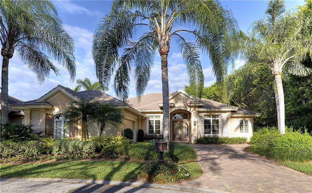 3274 Sedge Place Naples, FL 34105 - Photo 24 of 24 a front view of a residential houses with yard and green space