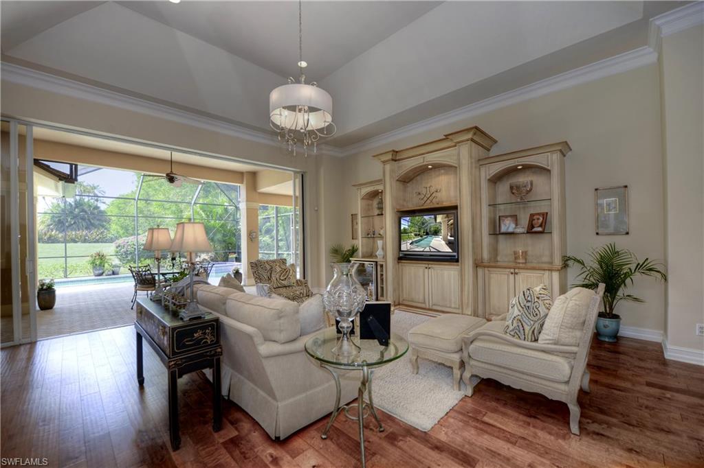 3274 Sedge Place Naples, FL 34105 - Photo 3 of 24 a living room with furniture and a large window