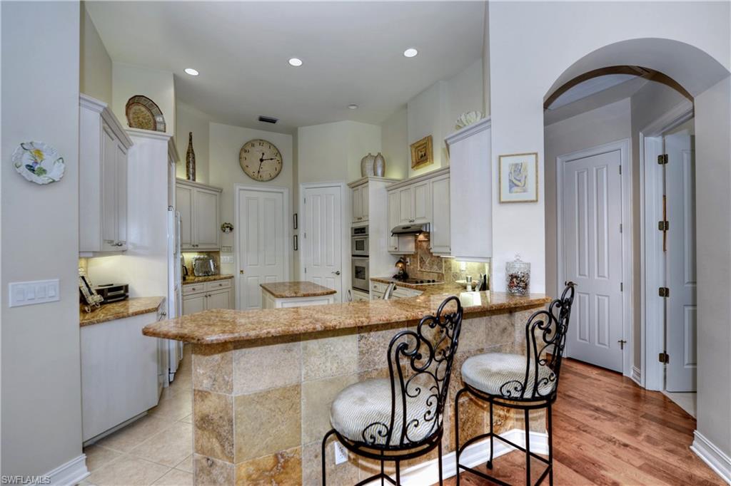 3274 Sedge Place Naples, FL 34105 - Photo 6 of 24 a view of a dining room with furniture