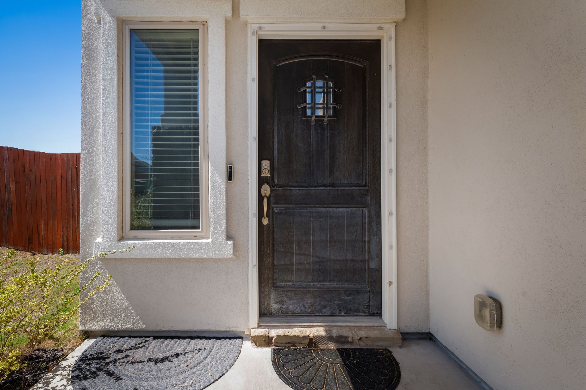 974 Pepperbark Loop Buda, TX 78610 - Photo 4 of 40 Entrance to property featuring stucco siding.