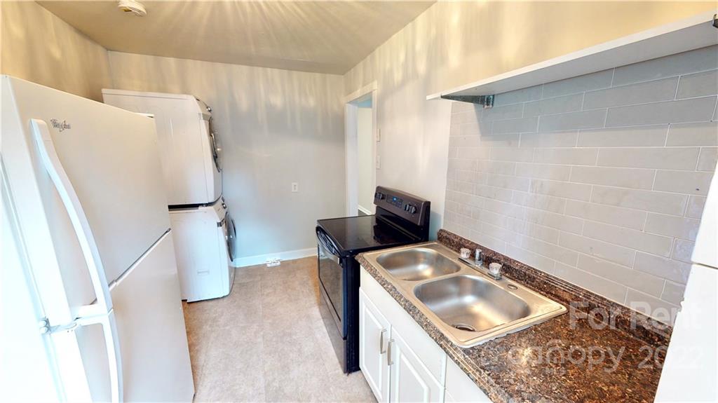 825 Rodey Avenue, Unit 1 Charlotte, NC 28206 - Photo 11 of 15 a bathroom with a tub sink and mirror