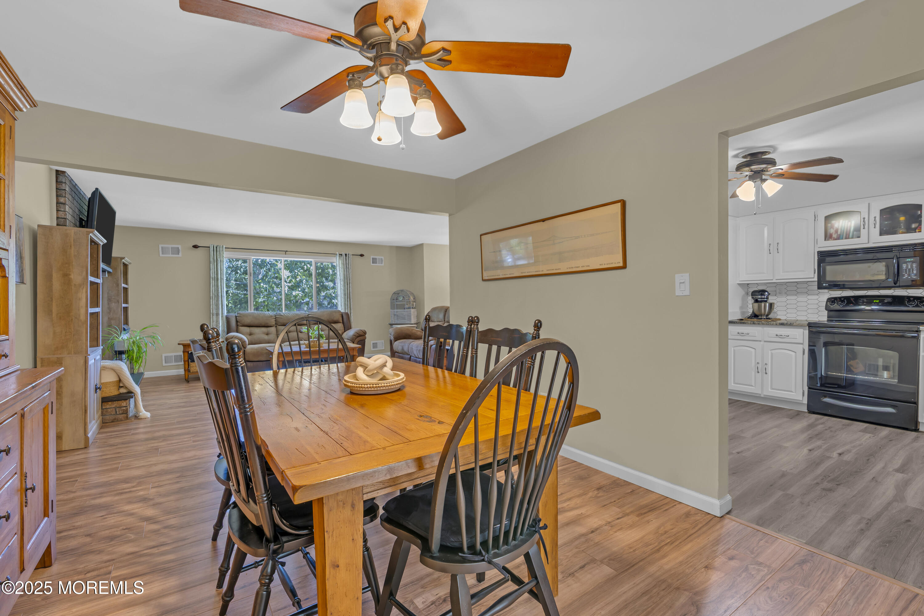 910 Woodlane Road Jackson, NJ 08527 - Photo 11 of 36 a view of a dining room with furniture and wooden floor